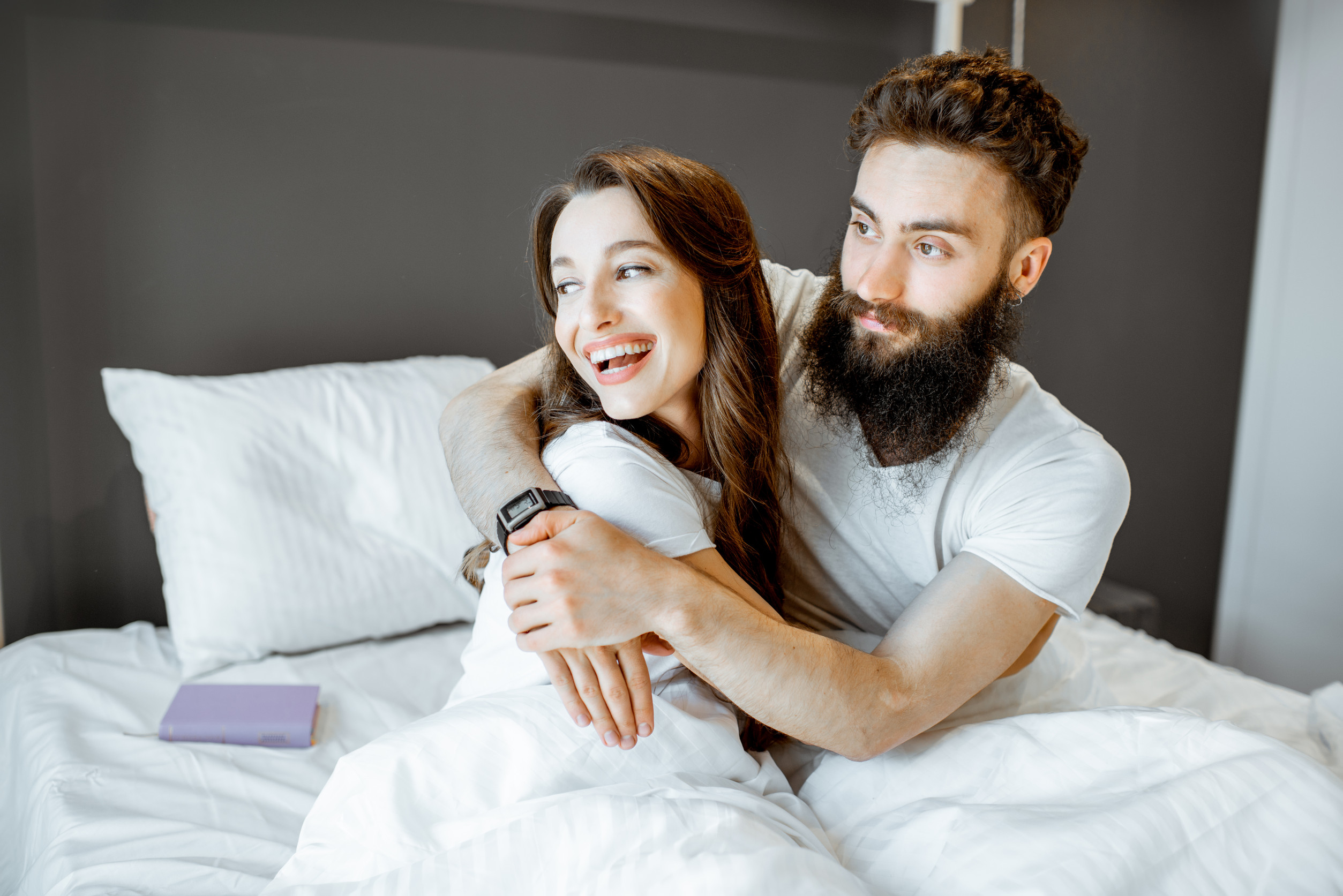 Happy couple in the bedroom